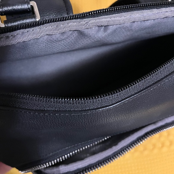 Tumi black leather style backpack- women